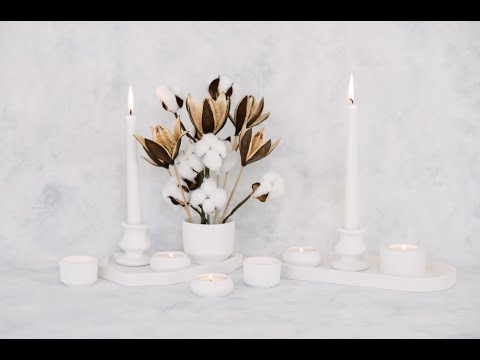 Video showing the petite, cylinder, cup, ribbed and square natural white concrete tea light holder.